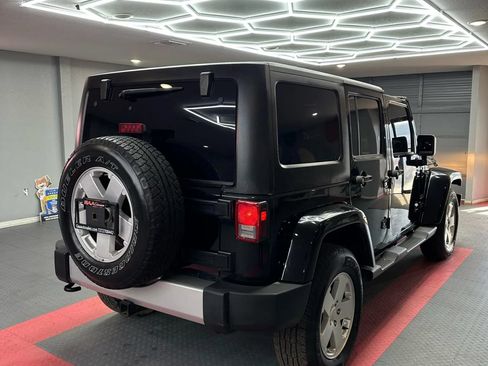 Used 2012 Jeep Wrangler Unlimited Sahara w/ Dual Top Group AWD/4WD image 7