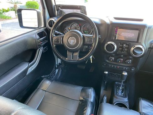 Used 2012 Jeep Wrangler Unlimited Sahara w/ Dual Top Group AWD/4WD image 25