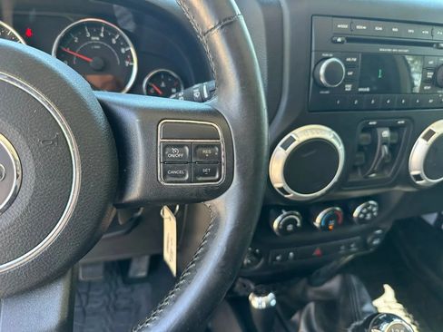 Used 2014 Jeep Wrangler Unlimited Sahara w/ Dual Top Group AWD/4WD image 20