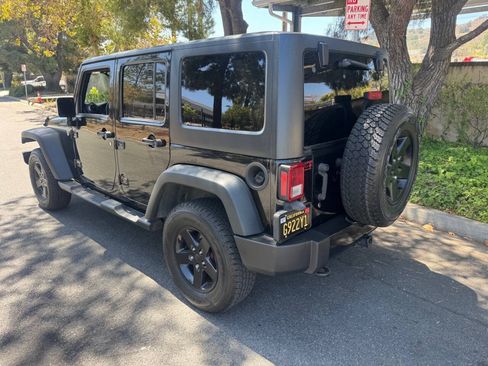 Used 2015 Jeep Wrangler Unlimited Sport w/ Dual Top Group AWD/4WD image 4