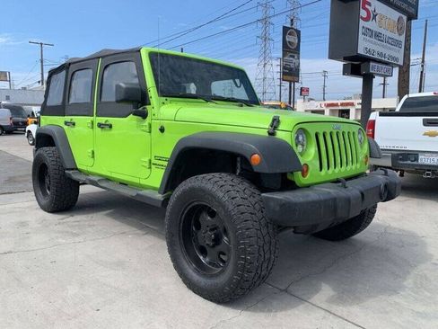 Used 2013 Jeep Wrangler Unlimited Sport w/ Mopar Black Appearance Group AWD/4WD image 1
