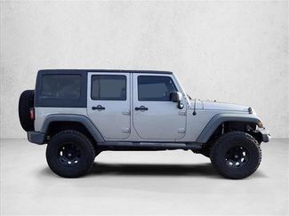 Used 2013 Jeep Wrangler Unlimited Sport w/ Mopar Black Appearance Group AWD/4WD video 4