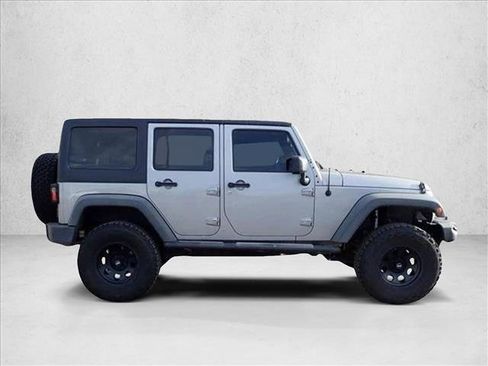 Used 2013 Jeep Wrangler Unlimited Sport w/ Mopar Black Appearance Group AWD/4WD image 4