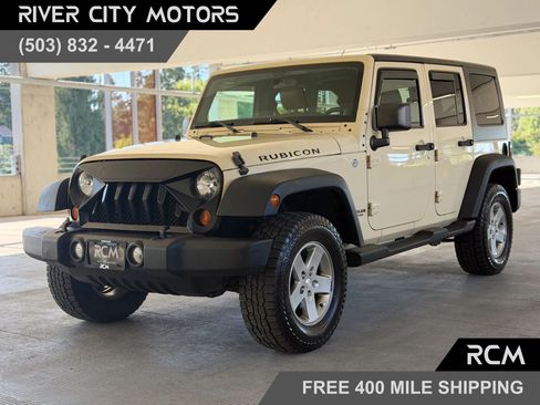 Used 2011 Jeep Wrangler Unlimited Rubicon w/ Dual Top Group AWD/4WD image 1