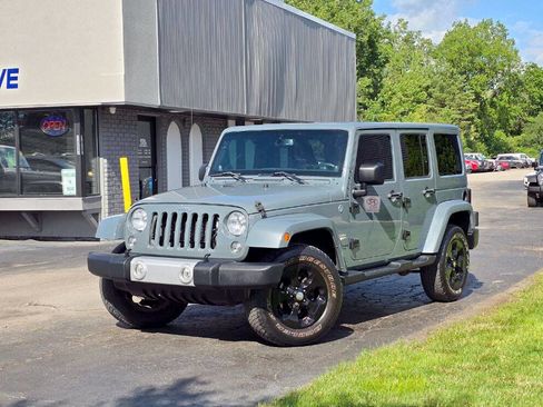 Used 2014 Jeep Wrangler Unlimited Sahara w/ Dual Top Group AWD/4WD image 2