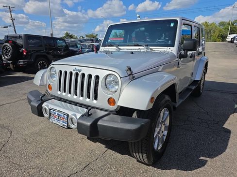 Used 2012 Jeep Wrangler Unlimited Sahara w/ Dual Top Group image 1