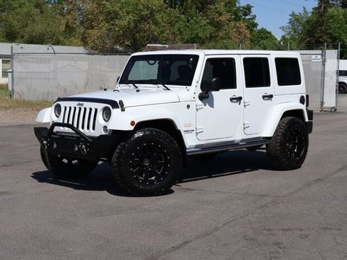 Used 2015 Jeep Wrangler Unlimited Sahara w/ Dual Top Group AWD/4WD image 1