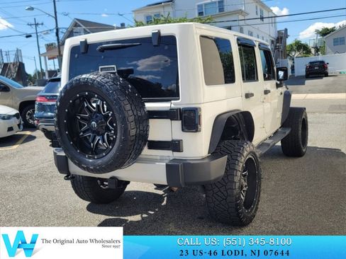 Used 2014 Jeep Wrangler Unlimited Sahara w/ Dual Top Group AWD/4WD image 6