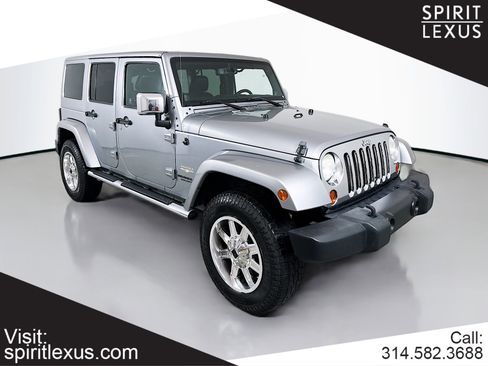 Used 2013 Jeep Wrangler Unlimited Sahara w/ Dual Top Group image 1