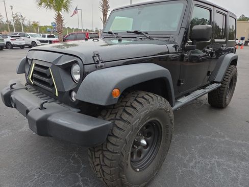 Used 2017 Jeep Wrangler Unlimited Sport w/ Mopar Black Appearance Group image 1