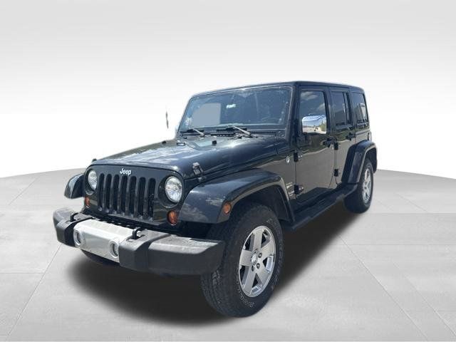 Used 2012 Jeep Wrangler Unlimited Sahara w/ Dual Top Group AWD/4WD image 7