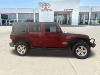 Used 2012 Jeep Wrangler Unlimited Sport AWD/4WD video 3
