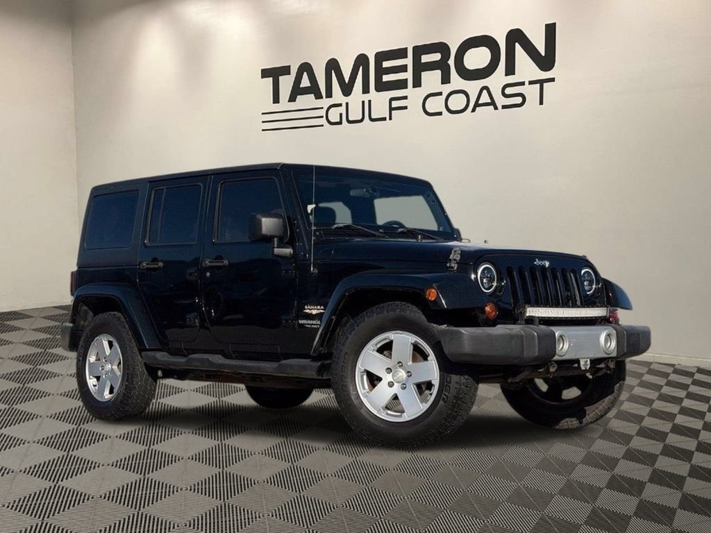 Used 2012 Jeep Wrangler Unlimited Sahara AWD/4WD image 1