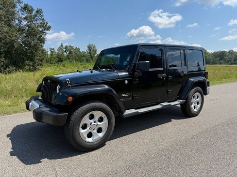 Used 2014 Jeep Wrangler Unlimited Sahara w/ Max Tow Package image 1
