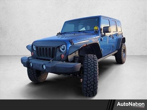 Used 2010 Jeep Wrangler Unlimited Rubicon w/ Dual Top Group image 1