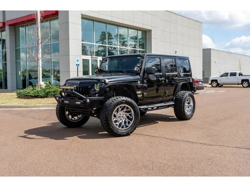 Used 2014 Jeep Wrangler Unlimited Sahara w/ Max Tow Package image 1