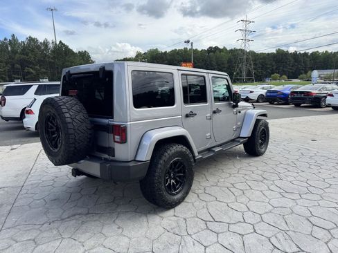 Used 2015 Jeep Wrangler Unlimited Sahara w/ Dual Top Group AWD/4WD image 13