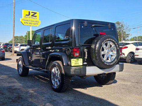 Used 2014 Jeep Wrangler Unlimited Sahara w/ Dual Top Group AWD/4WD image 4