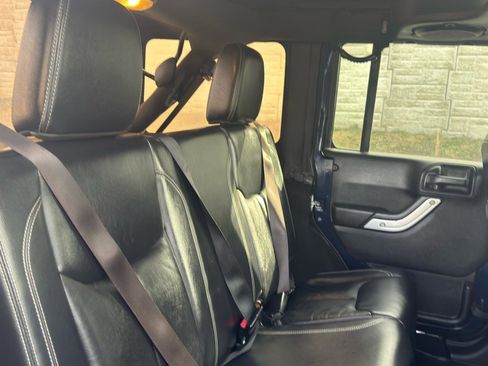 Used 2013 Jeep Wrangler Unlimited Sahara w/ Dual Top Group AWD/4WD image 12