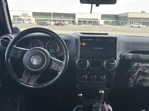 Used 2012 Jeep Wrangler Unlimited Sport w/ Black Appearance Group AWD/4WD image 25