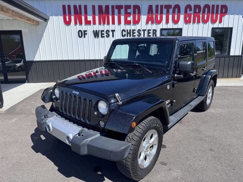 Used 2014 Jeep Wrangler Unlimited Sahara w/ Dual Top Group AWD/4WD image 1