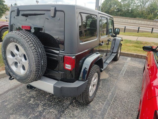 Used 2014 Jeep Wrangler Unlimited Sahara w/ Dual Top Group AWD/4WD image 16