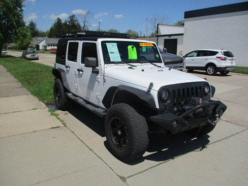 Used 2012 Jeep Wrangler Unlimited Sport image 1