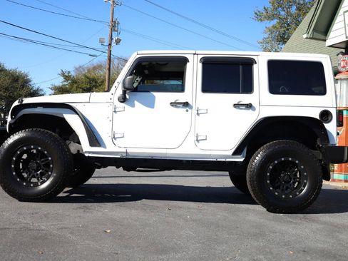 Used 2013 Jeep Wrangler Unlimited Sahara w/ Dual Top Group image 2