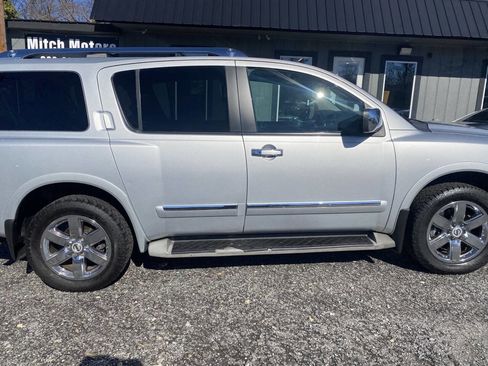 Used 2011 Nissan Armada Platinum w/ 2nd Row Captain Seat Pkg image 1
