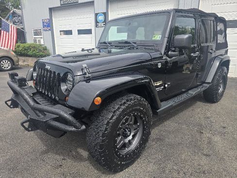 Used 2013 Jeep Wrangler Unlimited Sahara w/ Dual Top Group AWD/4WD image 1