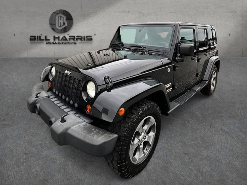 Used 2012 Jeep Wrangler Unlimited Sahara w/ Dual Top Group AWD/4WD image 1
