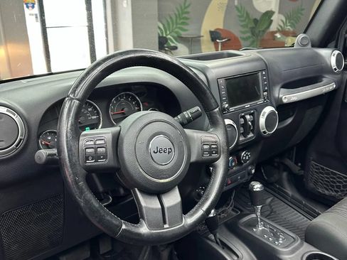 Used 2012 Jeep Wrangler Unlimited Sahara w/ Dual Top Group AWD/4WD image 11