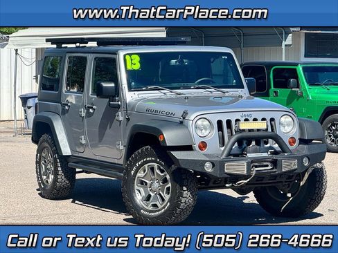 Used 2013 Jeep Wrangler Unlimited Rubicon w/ Dual Top Group AWD/4WD image 1