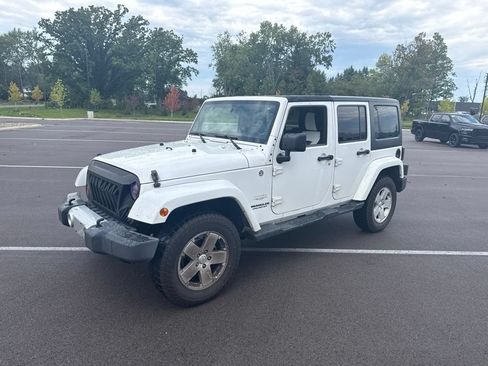 Used 2012 Jeep Wrangler Unlimited Sahara w/ Dual Top Group AWD/4WD image 1