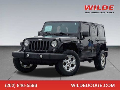 Used 2014 Jeep Wrangler Unlimited Sahara w/ Max Tow Package image 1