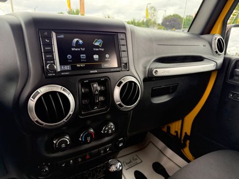 Used 2015 Jeep Wrangler Unlimited Sahara w/ Dual Top Group AWD/4WD image 11
