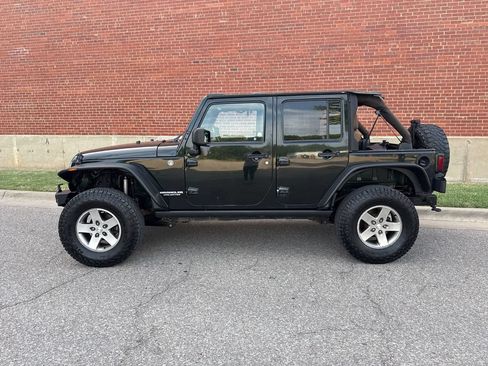Used 2012 Jeep Wrangler Unlimited Rubicon w/ Dual Top Group AWD/4WD image 2