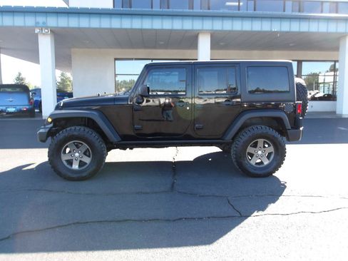 Used 2011 Jeep Wrangler Unlimited Rubicon w/ Dual Top Group AWD/4WD image 2