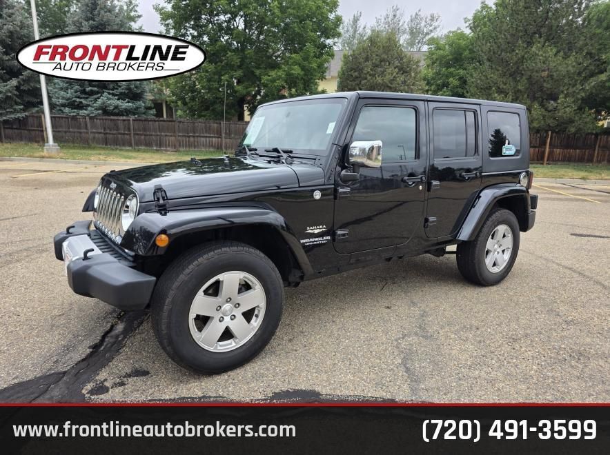 Used 2010 Jeep Wrangler Unlimited Sahara w/ Dual Top Group AWD/4WD image 1