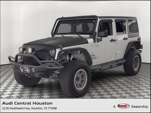 Used 2012 Jeep Wrangler Unlimited Sport AWD/4WD image 1