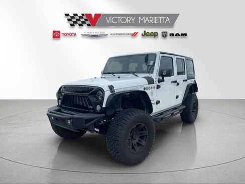 Used 2016 Jeep Wrangler Unlimited Sahara w/ Dual Top Group AWD/4WD image 1