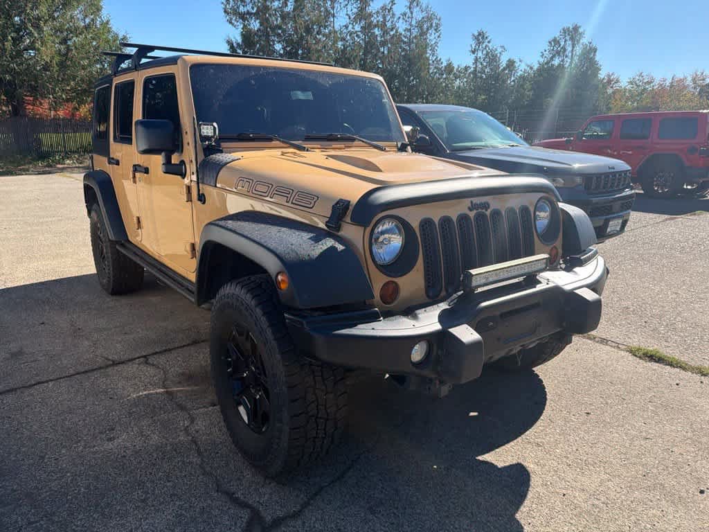 Used 2013 Jeep Wrangler Unlimited Sahara AWD/4WD image 1