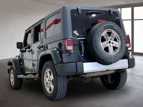 Used 2012 Jeep Wrangler Unlimited Sahara w/ Dual Top Group AWD/4WD image 13