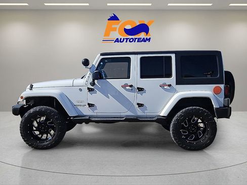 Used 2013 Jeep Wrangler Unlimited Sahara w/ Dual Top Group AWD/4WD image 2