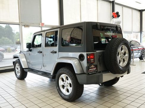 Used 2014 Jeep Wrangler Unlimited Sahara w/ Dual Top Group AWD/4WD image 4