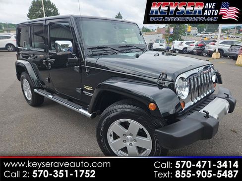 Used 2012 Jeep Wrangler Unlimited Sahara w/ Dual Top Group AWD/4WD image 1
