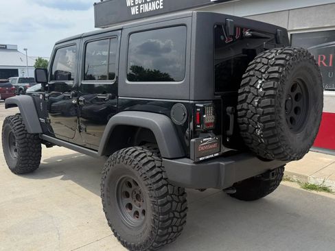 Used 2014 Jeep Wrangler Unlimited Rubicon w/ Dual Top Group AWD/4WD image 4