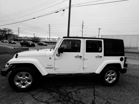 Used 2013 Jeep Wrangler Unlimited Sahara w/ Dual Top Group image 1