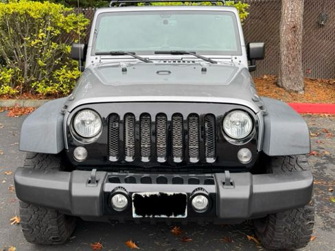 Used 2015 Jeep Wrangler Sport image 1