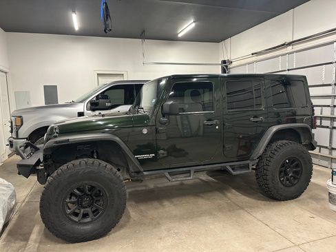 Used 2011 Jeep Wrangler Unlimited Sahara w/ Connectivity Group AWD/4WD image 1